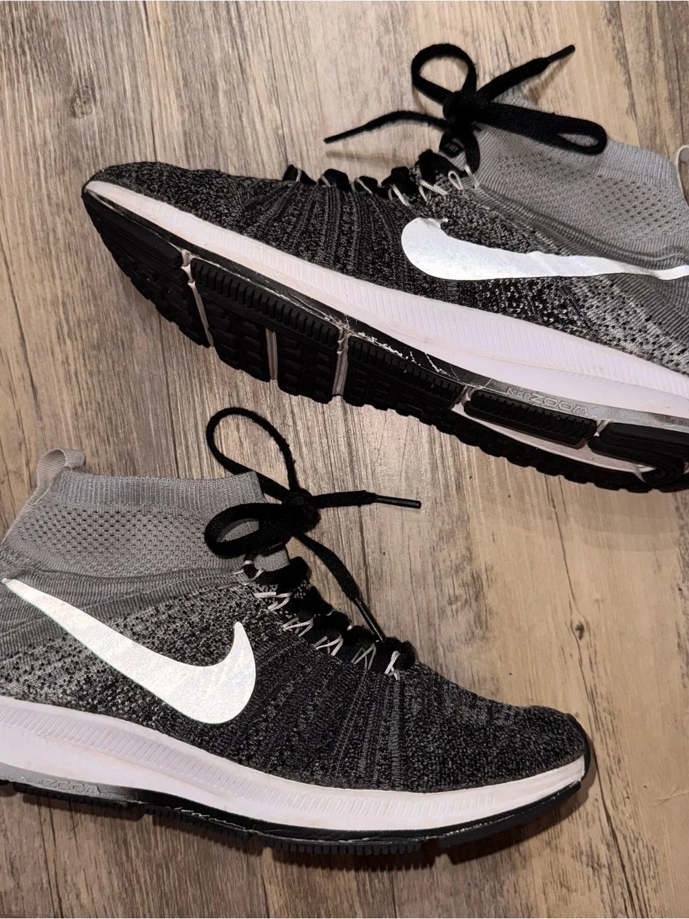 Nike Kids Black and Gray Flyknit High-Top Sneakers with White Swoosh